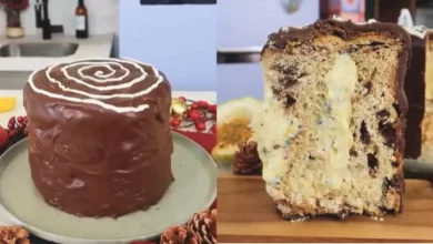 Fatia de Chocotone com Recheio de Maracujá cremoso e vibrante, visível em corte. A sobremesa festiva está decorada com raspas de chocolate e sementes de maracujá, em um cenário de Natal aconchegante.